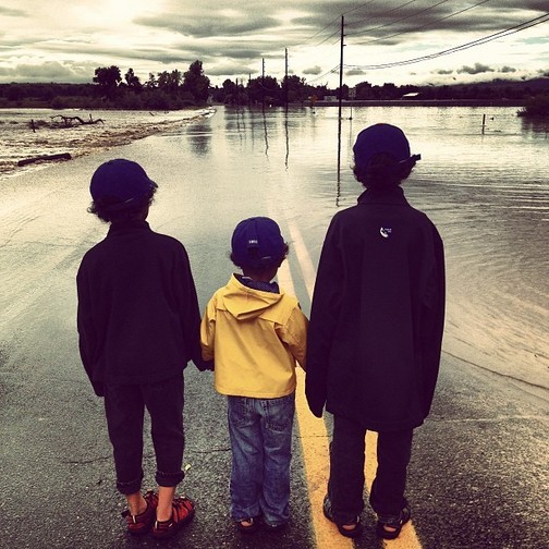 Chris Clauseens kids looking at the road in front of their house